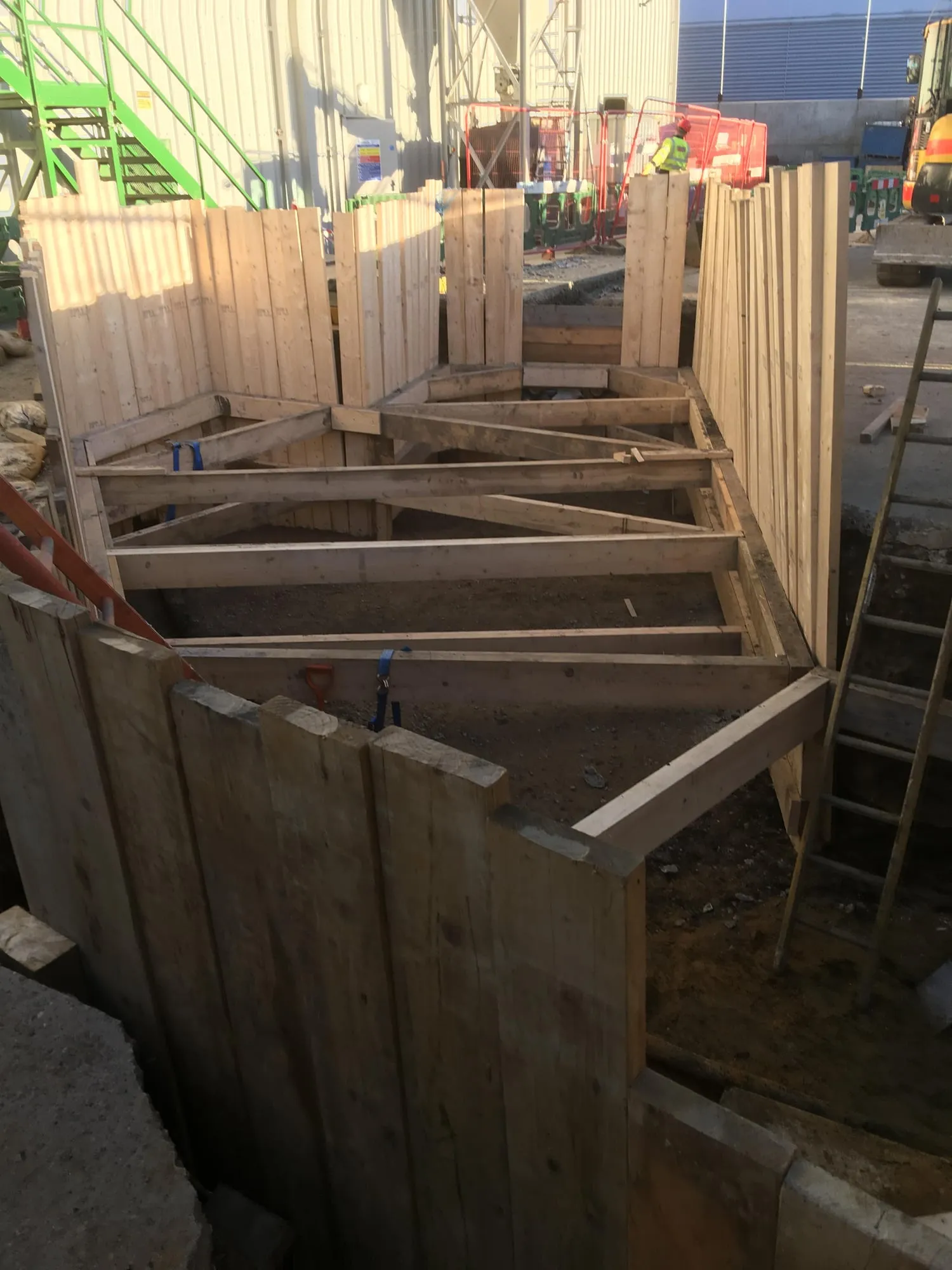 Timber trench support in a deep utility excavation